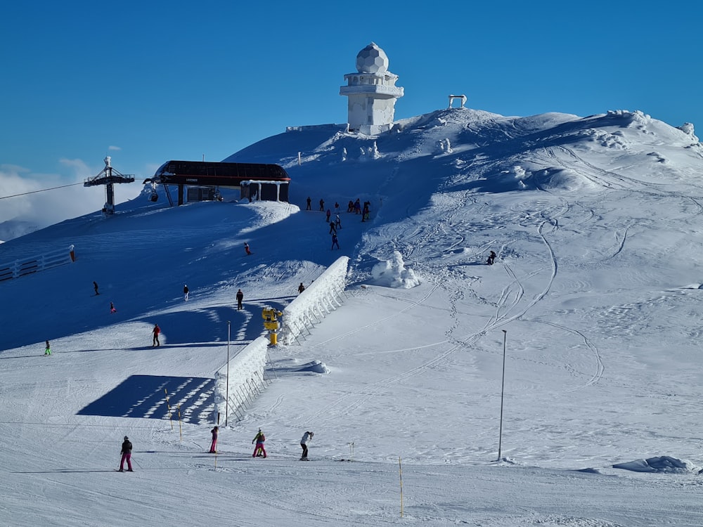 people walking on snow covered field during daytime