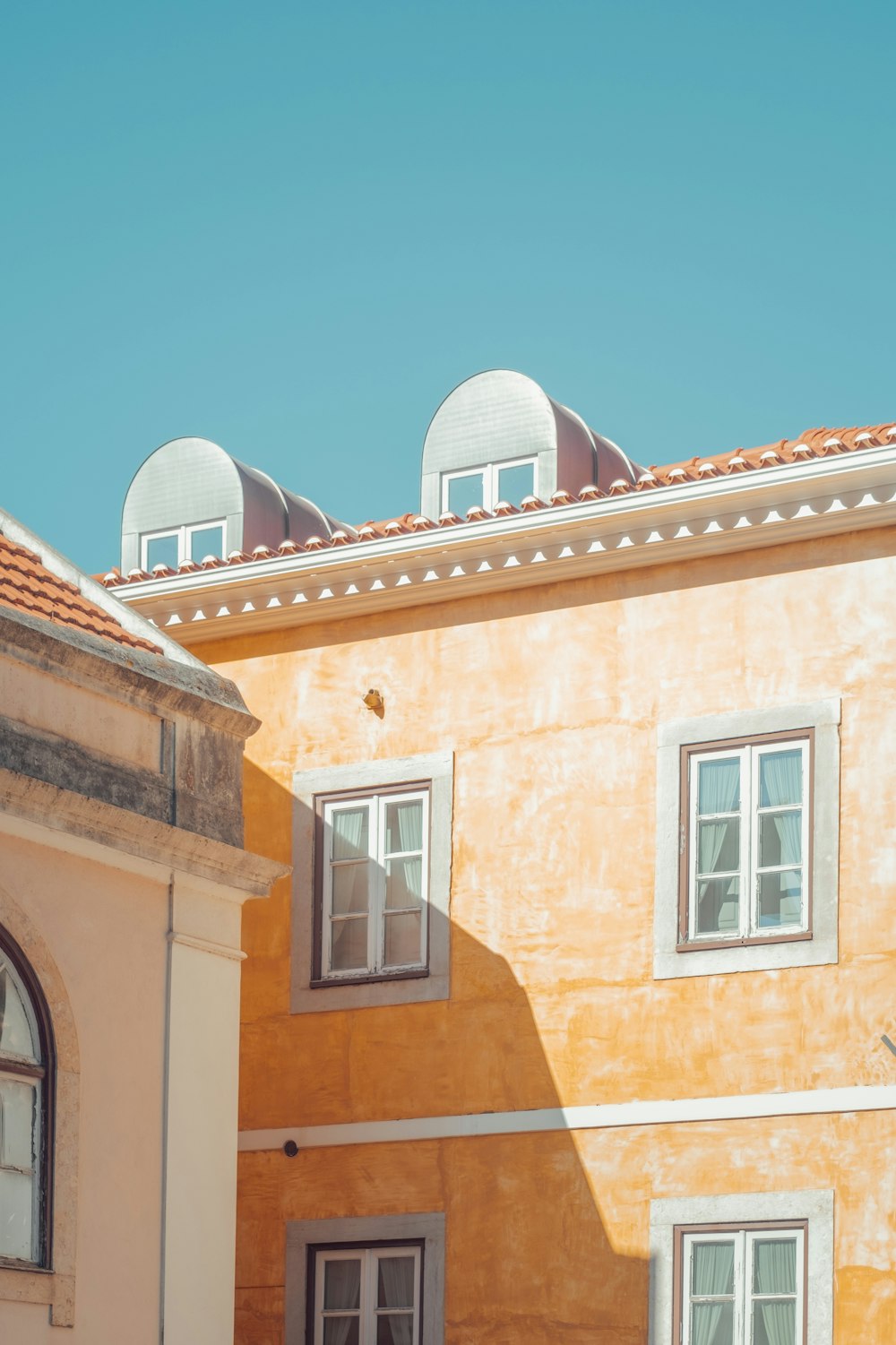 brown brick building under blue sky during daytime