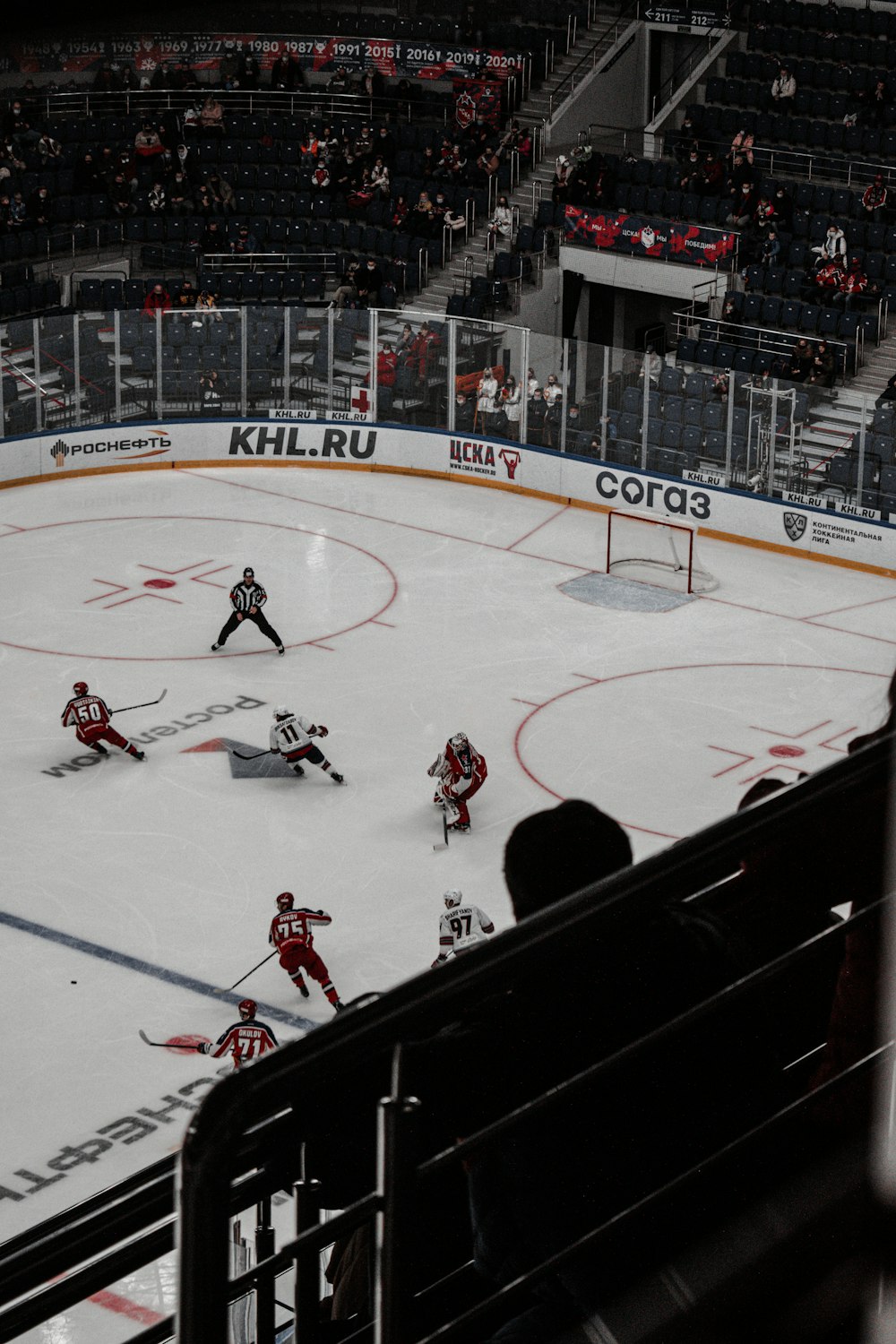 people playing ice hockey on ice stadium