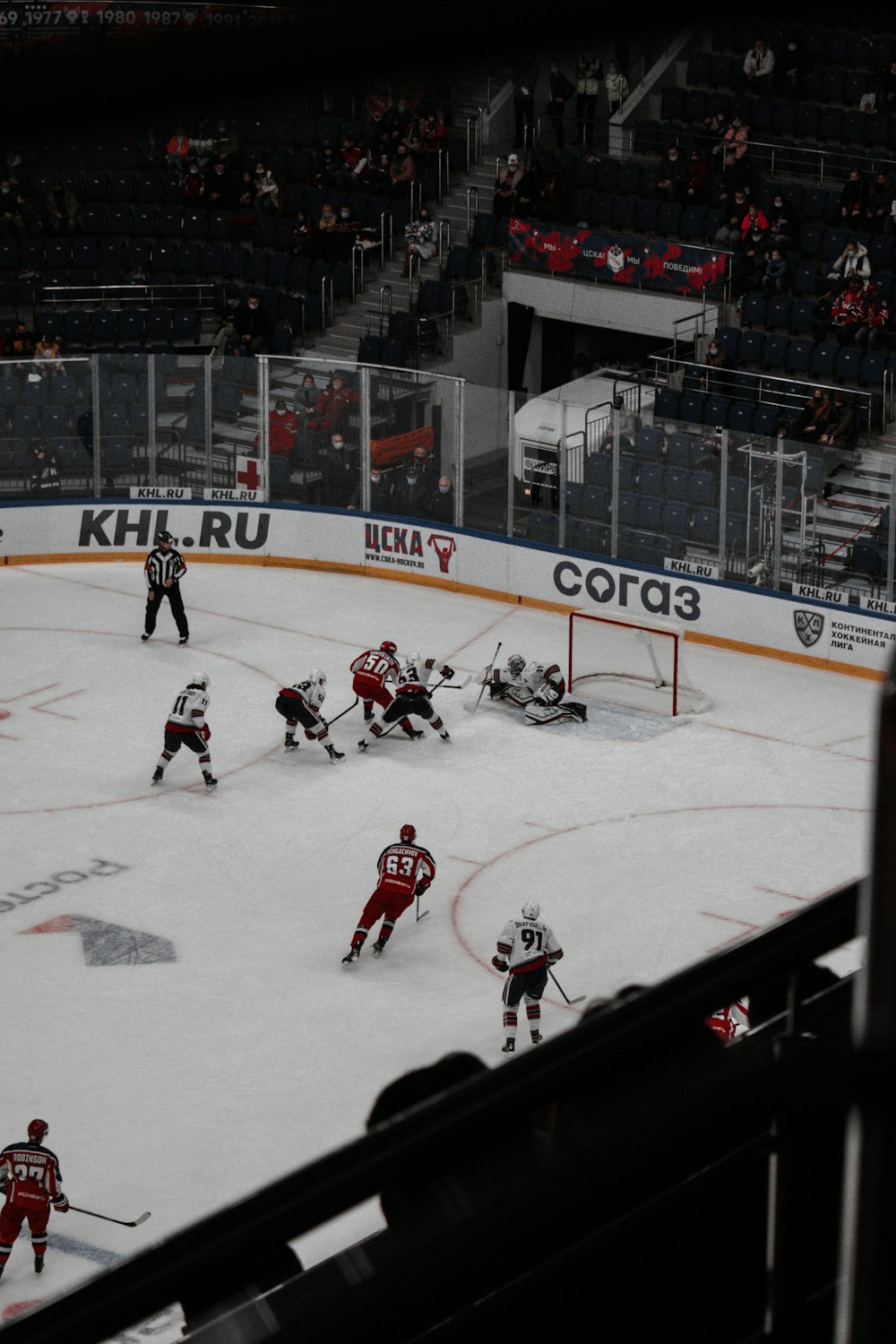 people playing ice hockey on ice field