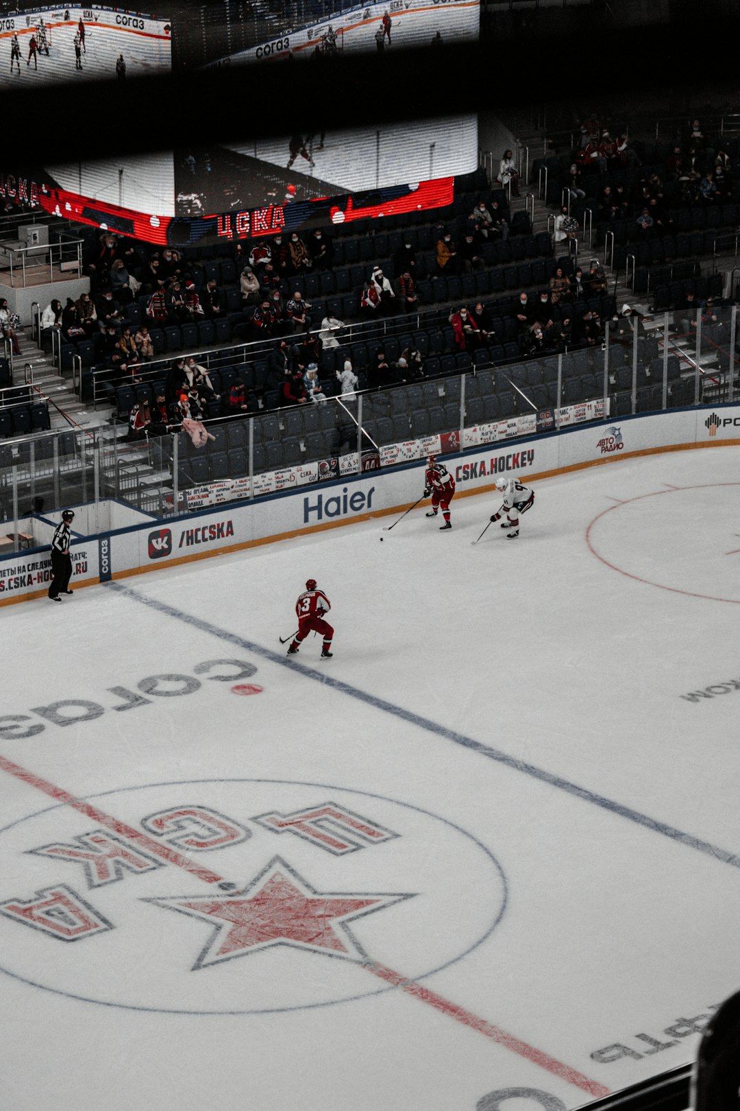 people playing ice hockey on stadium