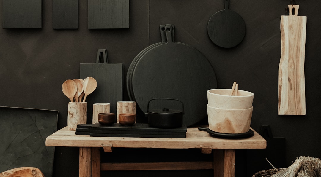 black cooking pot on brown wooden table