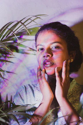 A peaceful moment with a customer holding a bioenergy product, surrounded by colorful lights and plants.