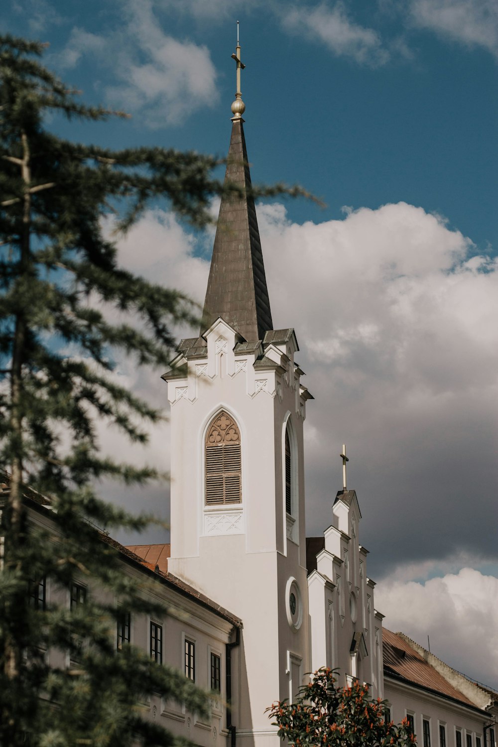 white and brown concrete church under blue sky during daytime