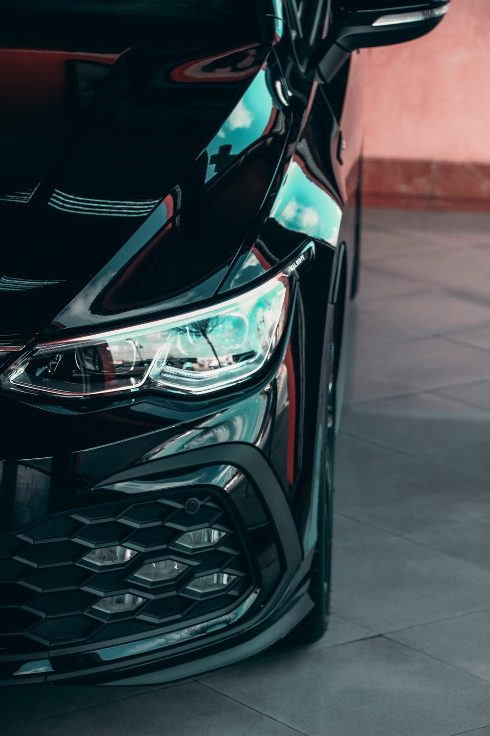 black and red car in close up photography