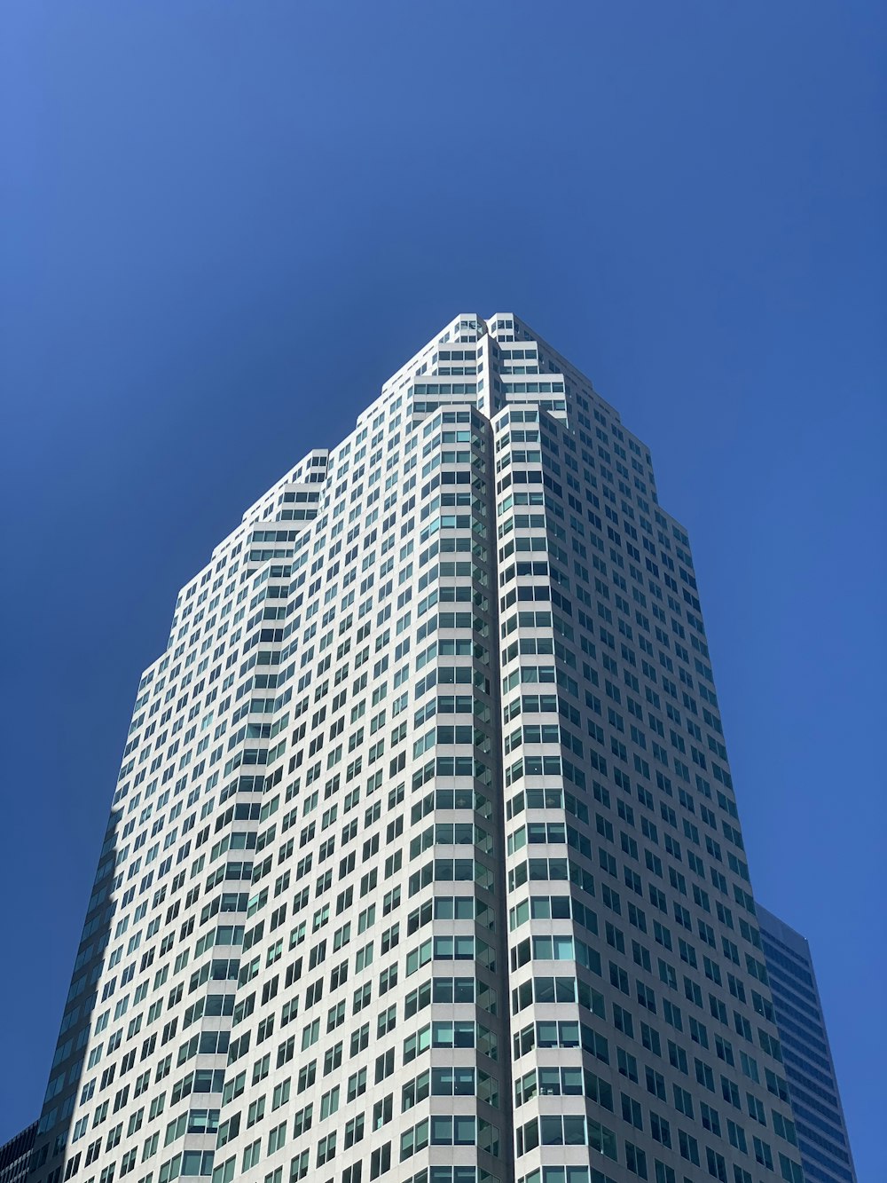 white and black concrete building under blue sky during daytime