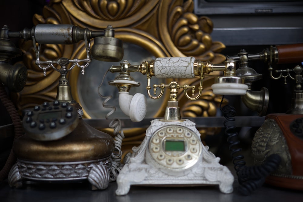 gold and silver rotary phone
