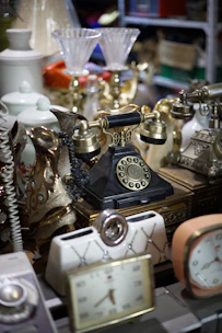 gold and silver analog alarm clock