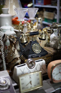 gold and silver analog alarm clock