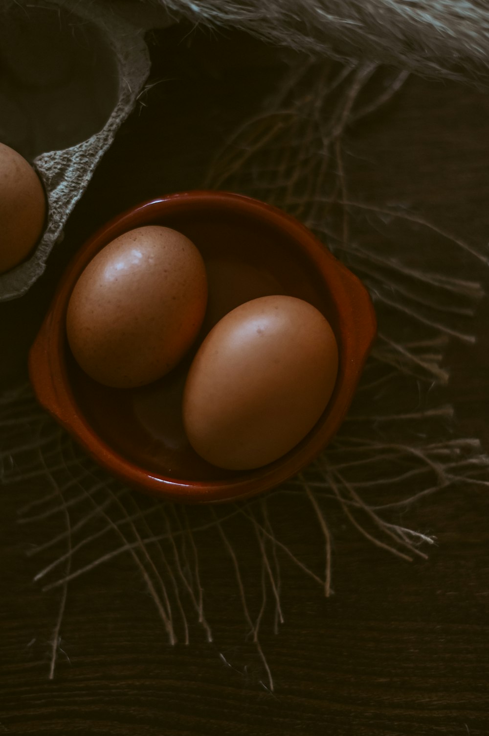 brown egg on brown ceramic bowl