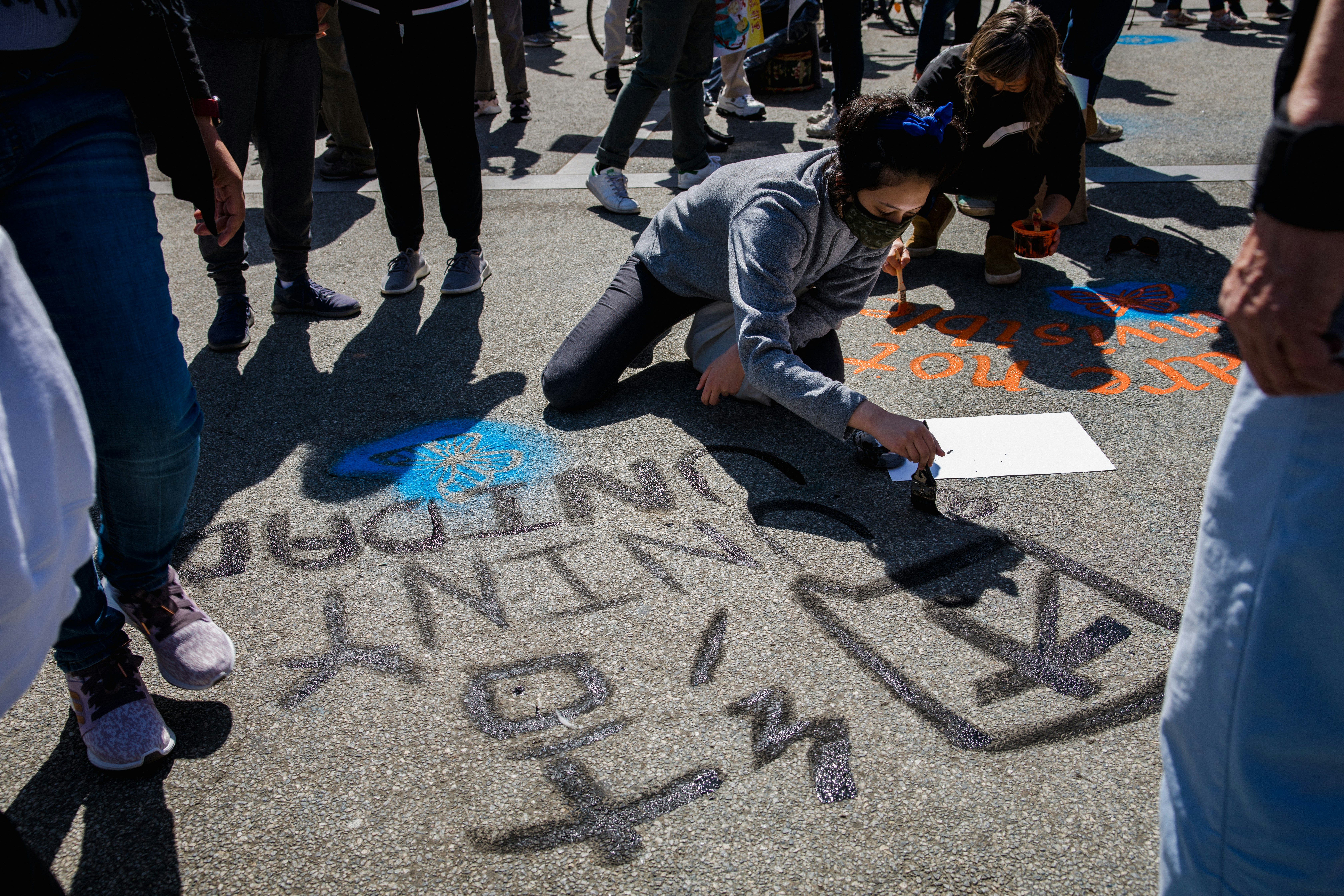 people walking on gray concrete pavement during daytime