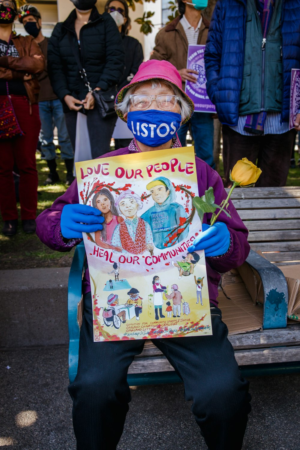 girl in blue jacket holding happy birthday greeting card