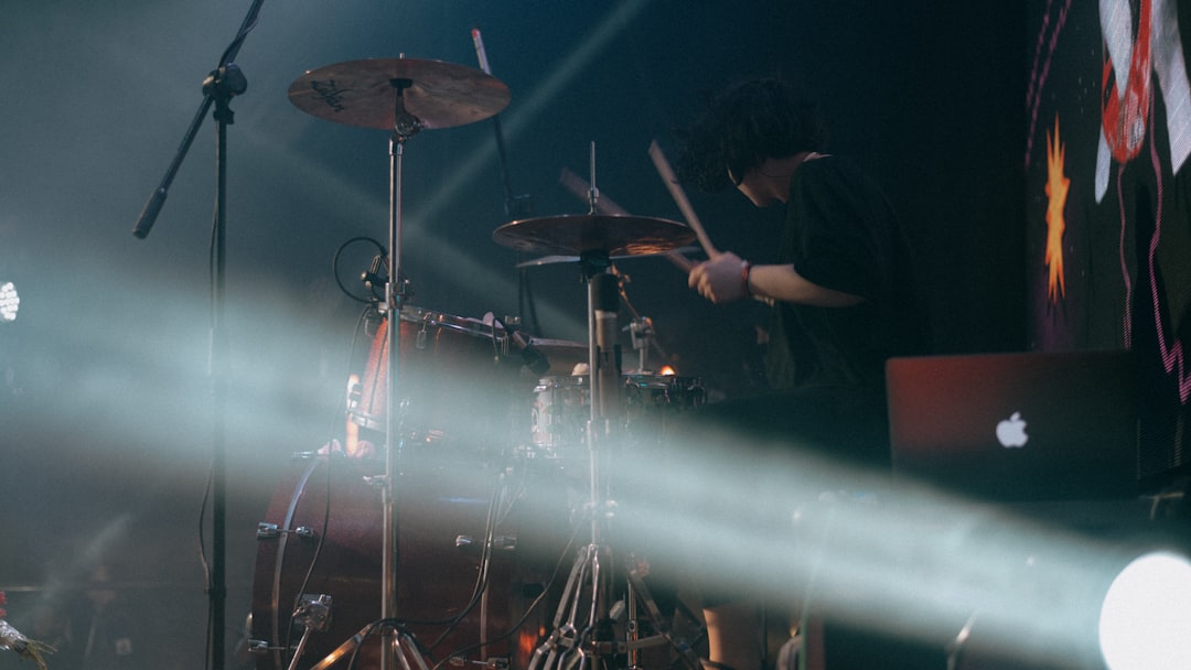 man playing drum on stage