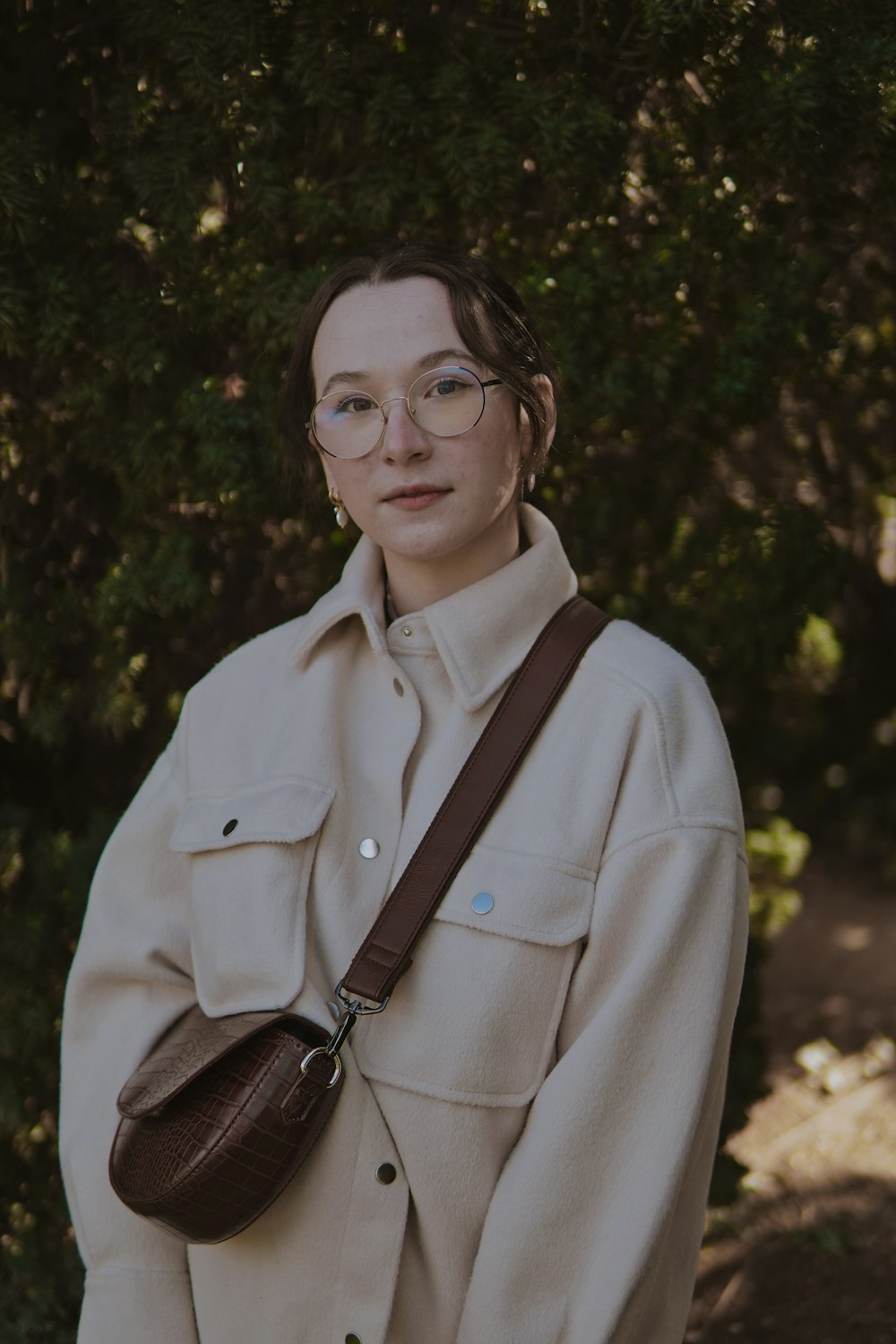 woman in white button up shirt wearing black framed eyeglasses