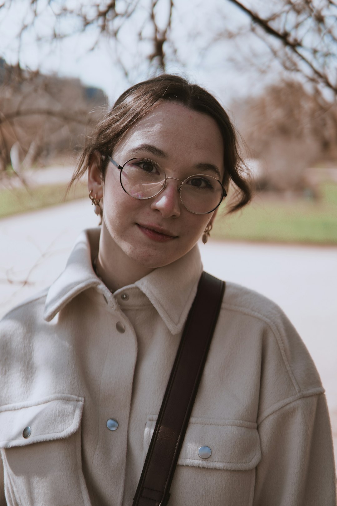 woman in white button up shirt wearing eyeglasses