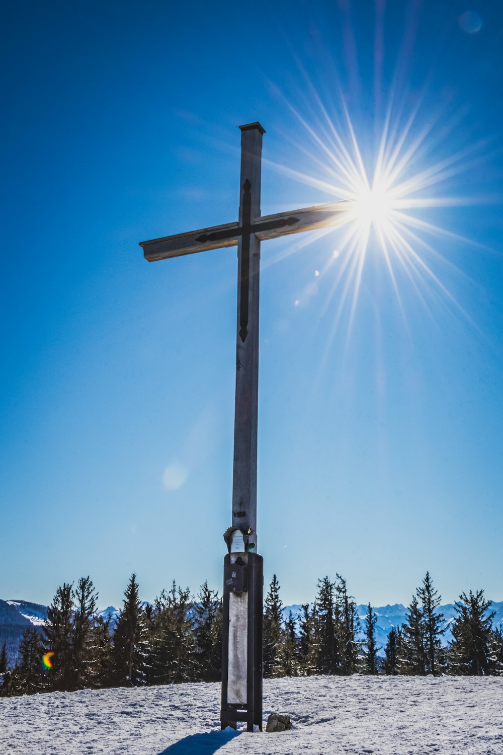 brown wooden cross under blue sky during daytime