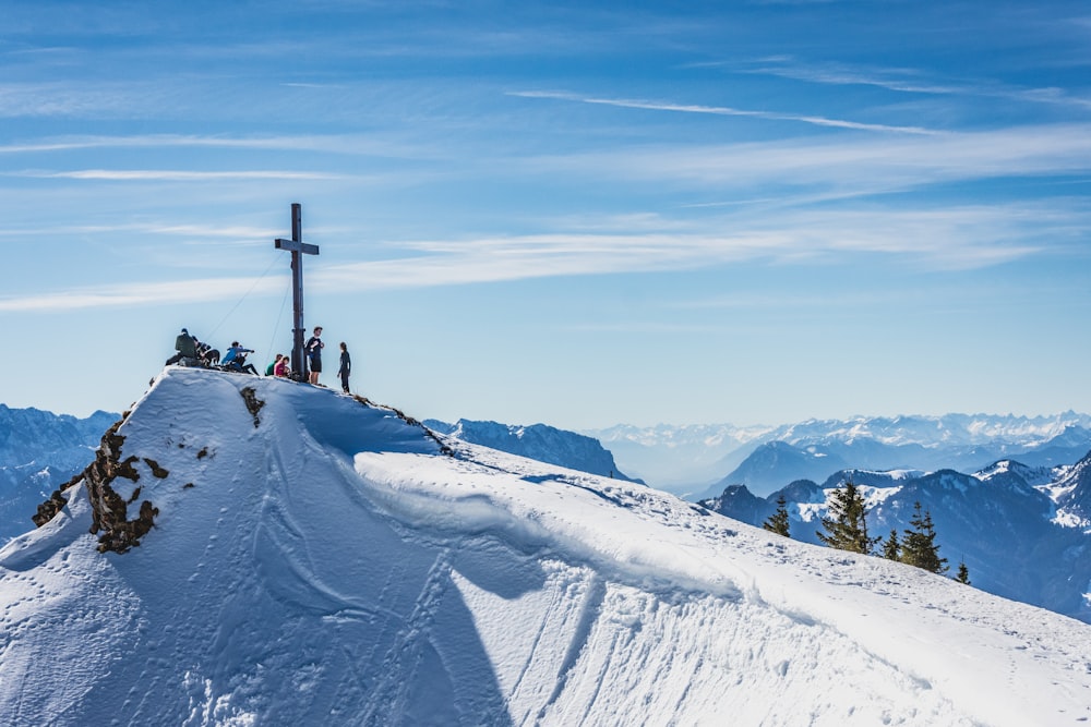 person standing on snow covered mountain during daytime