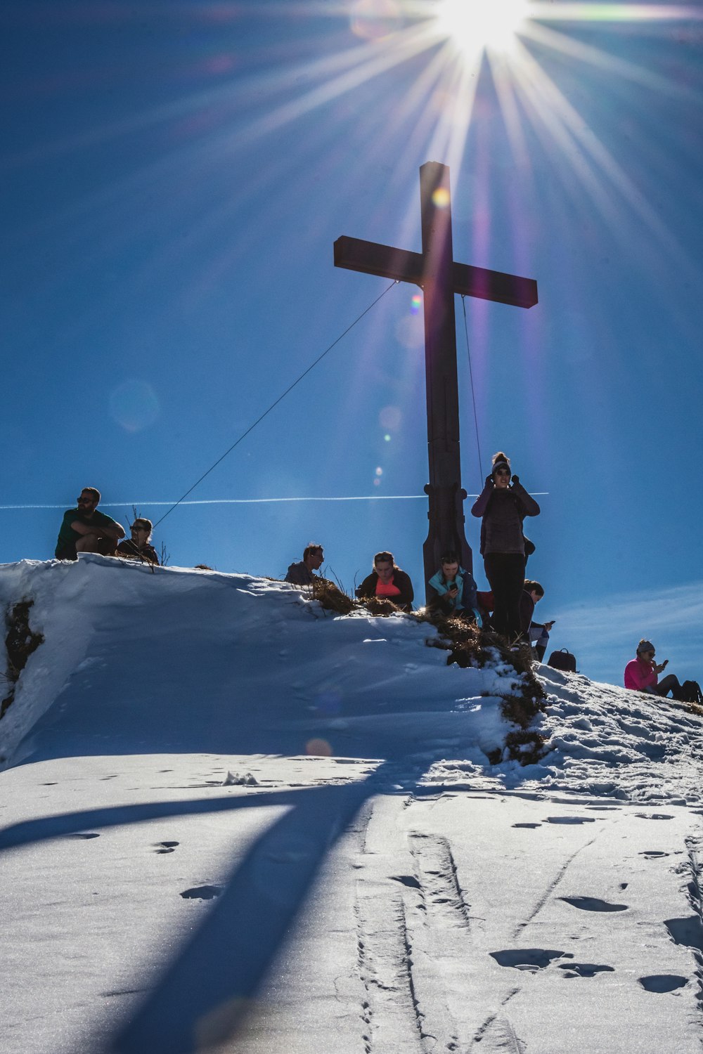 people on snow covered field under blue sky during daytime