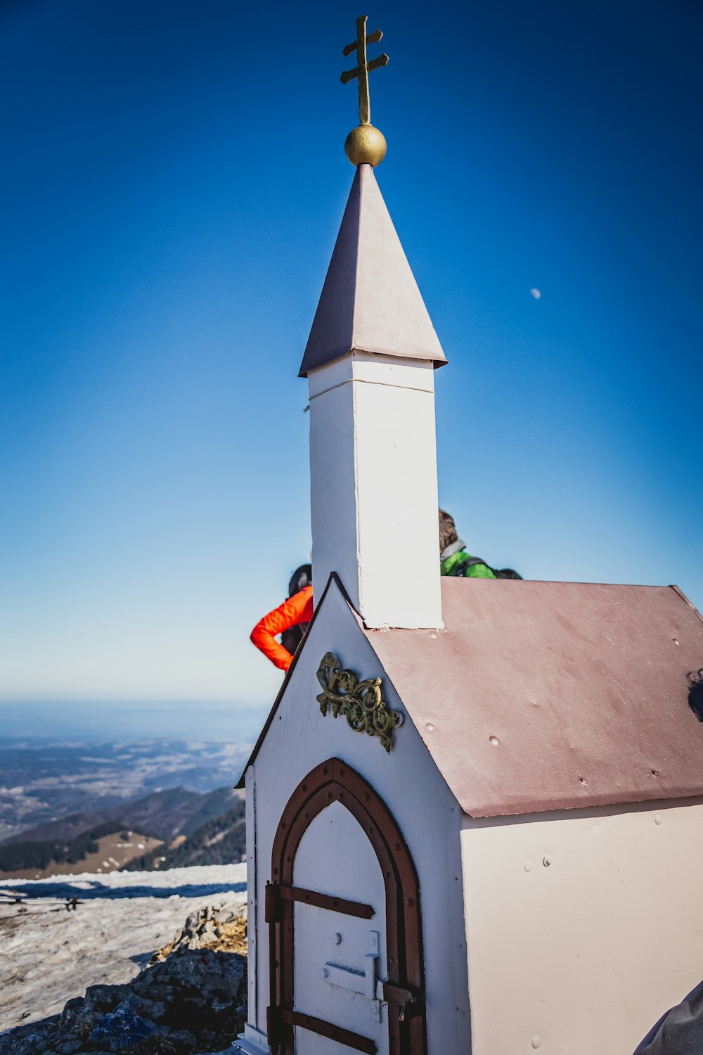 white and brown concrete church under blue sky during daytime