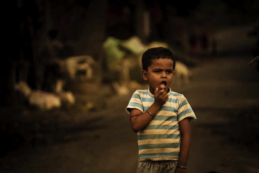 boy in white and blue striped t-shirt