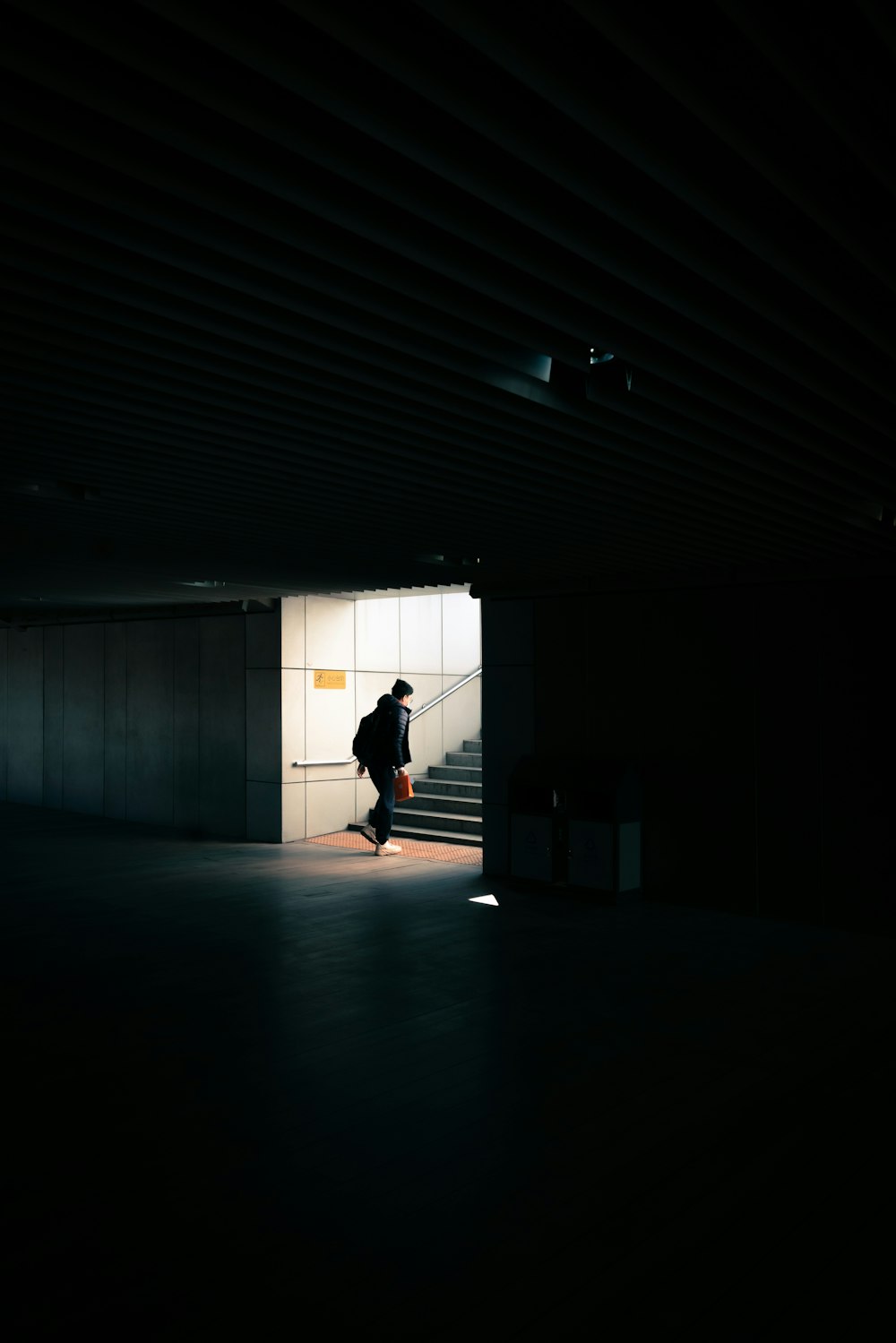 silhouette of person walking on hallway