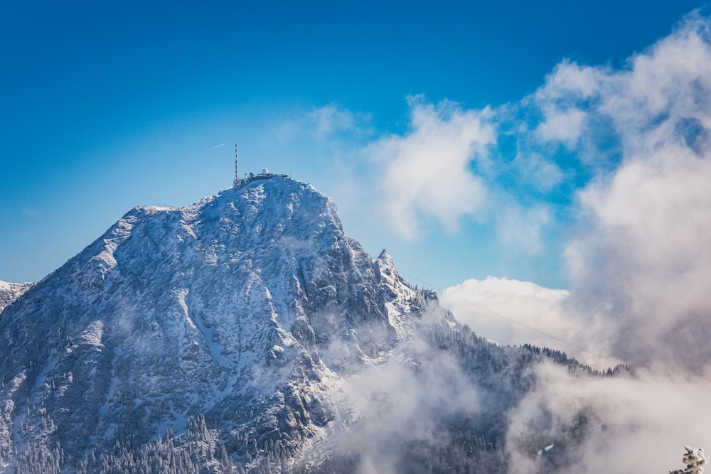 snow covered mountain under blue sky during daytime