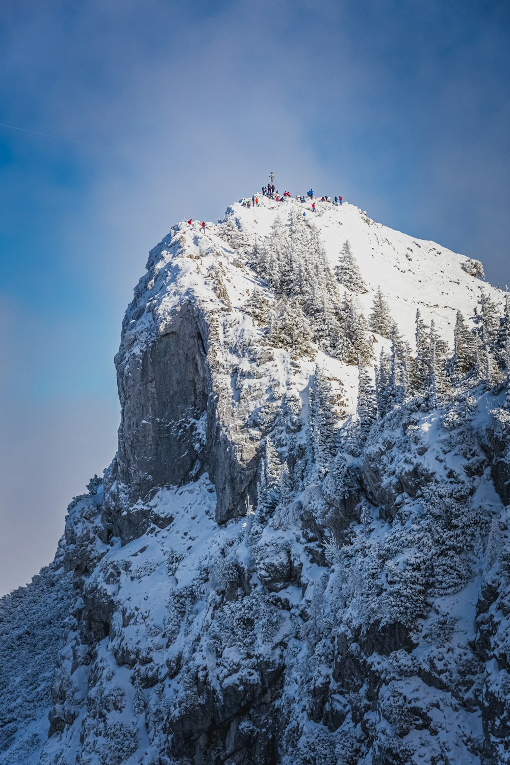 snow covered mountain under blue sky during daytime