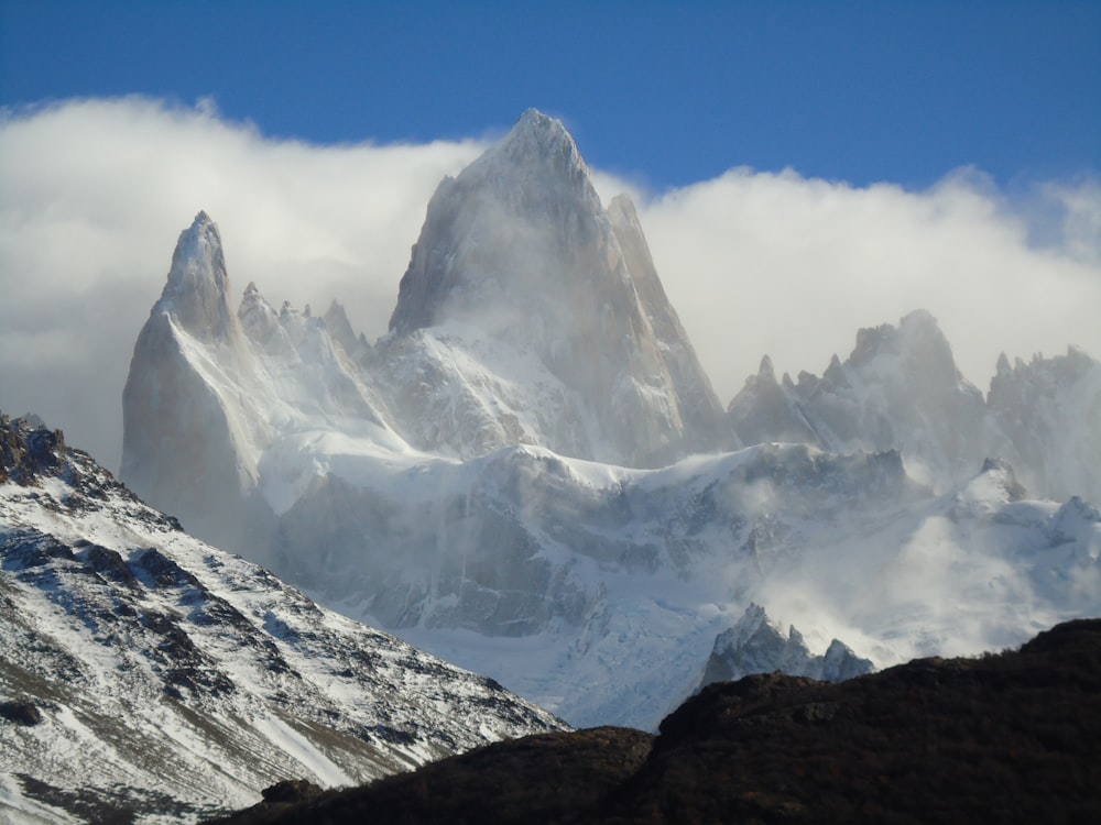 snow covered mountain under blue sky during daytime