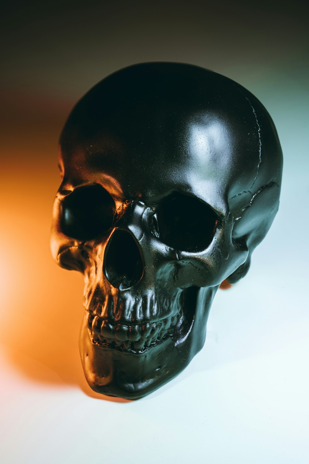 black skull on white surface
