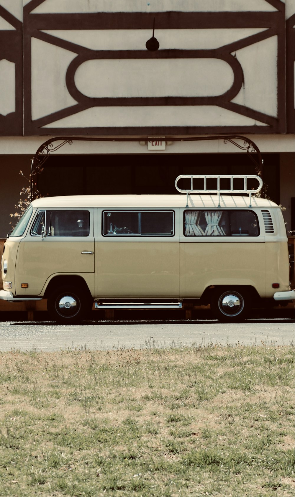 white and black volkswagen t-2 van on road during daytime