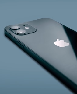 silver iphone 6 on blue surface