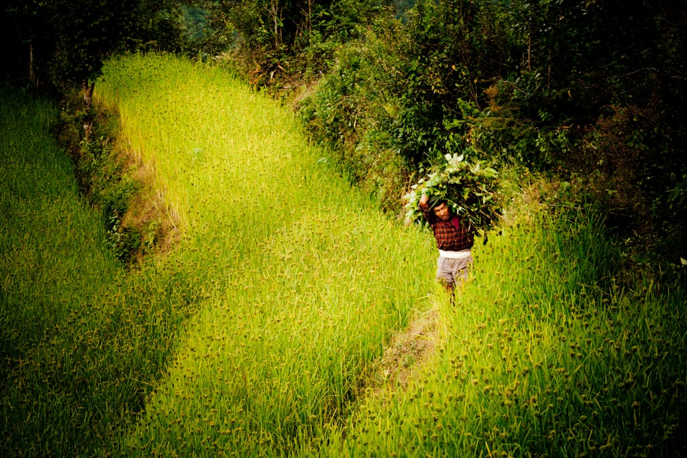 woman in white dress standing on green grass field during daytime