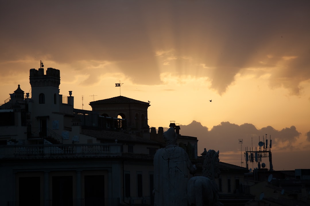 silhouette of concrete building during sunset