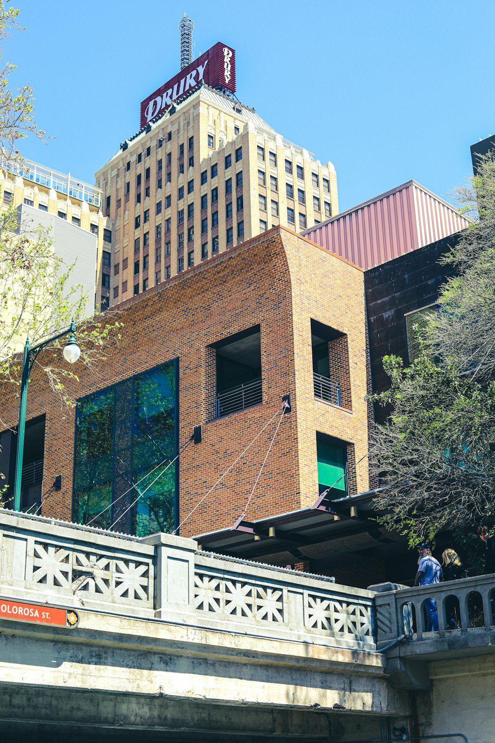 brown concrete building near green trees during daytime