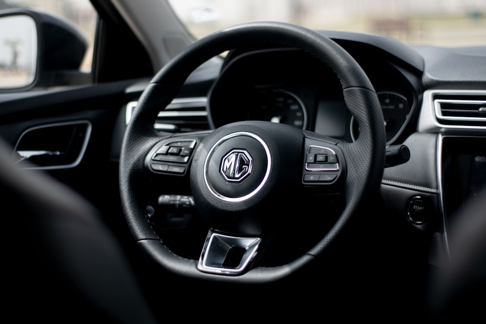 black and silver mercedes benz steering wheel