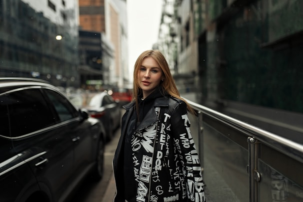 A young woman proudly holding her work visa with a bustling foreign cityscape behind her