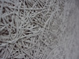 Close-up of textured composite fiber material with pixel-like details.