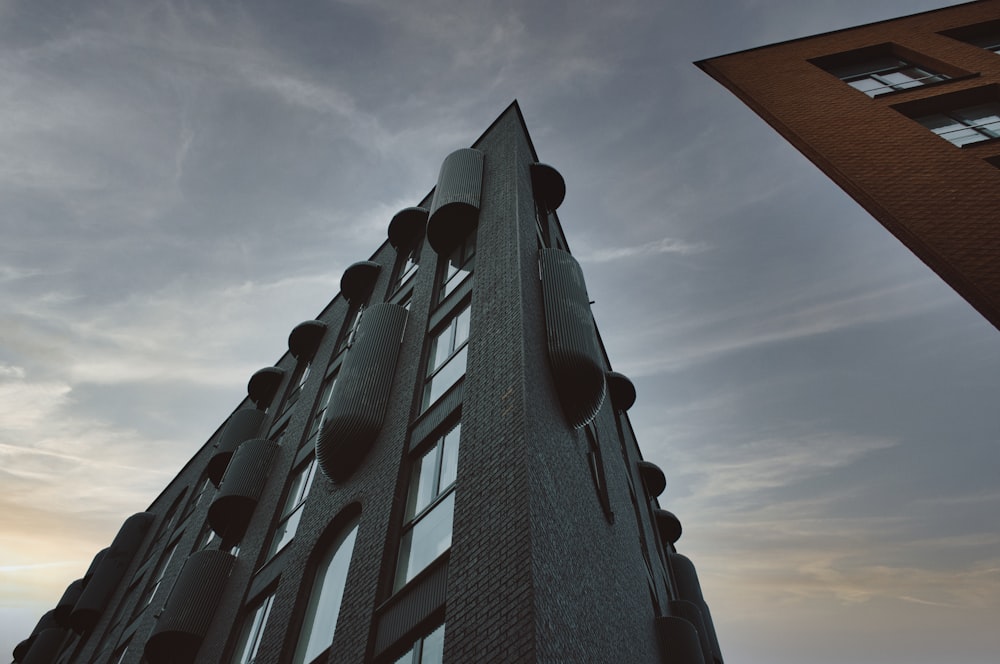 black concrete building under cloudy sky during daytime