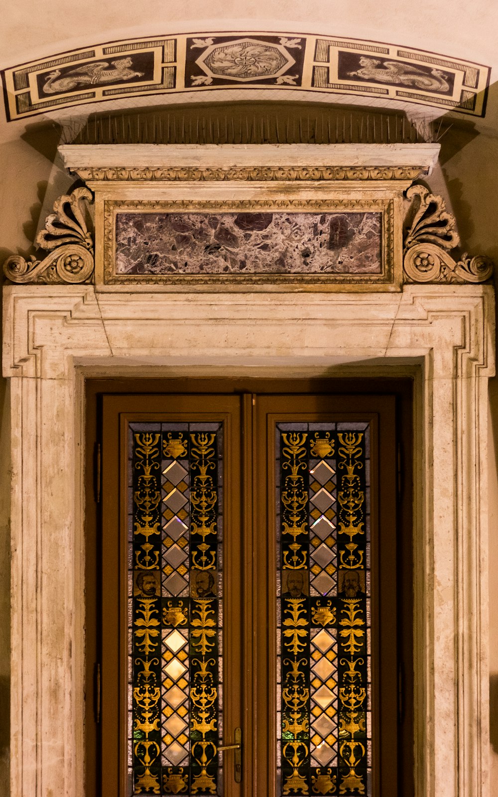 brown wooden door on white concrete wall