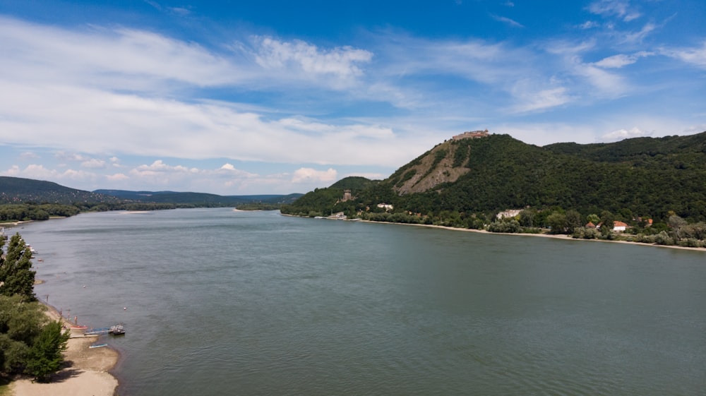 green and brown island under blue sky during daytime