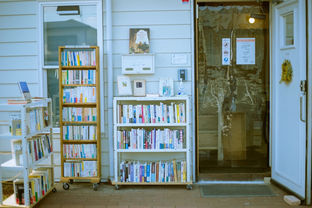 books on white wooden shelf