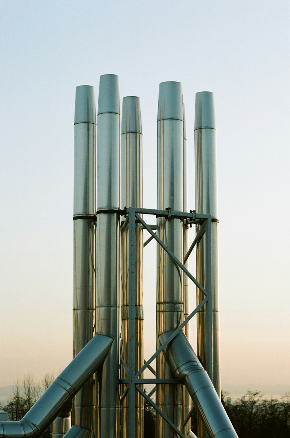 gray metal pipe under white sky during daytime