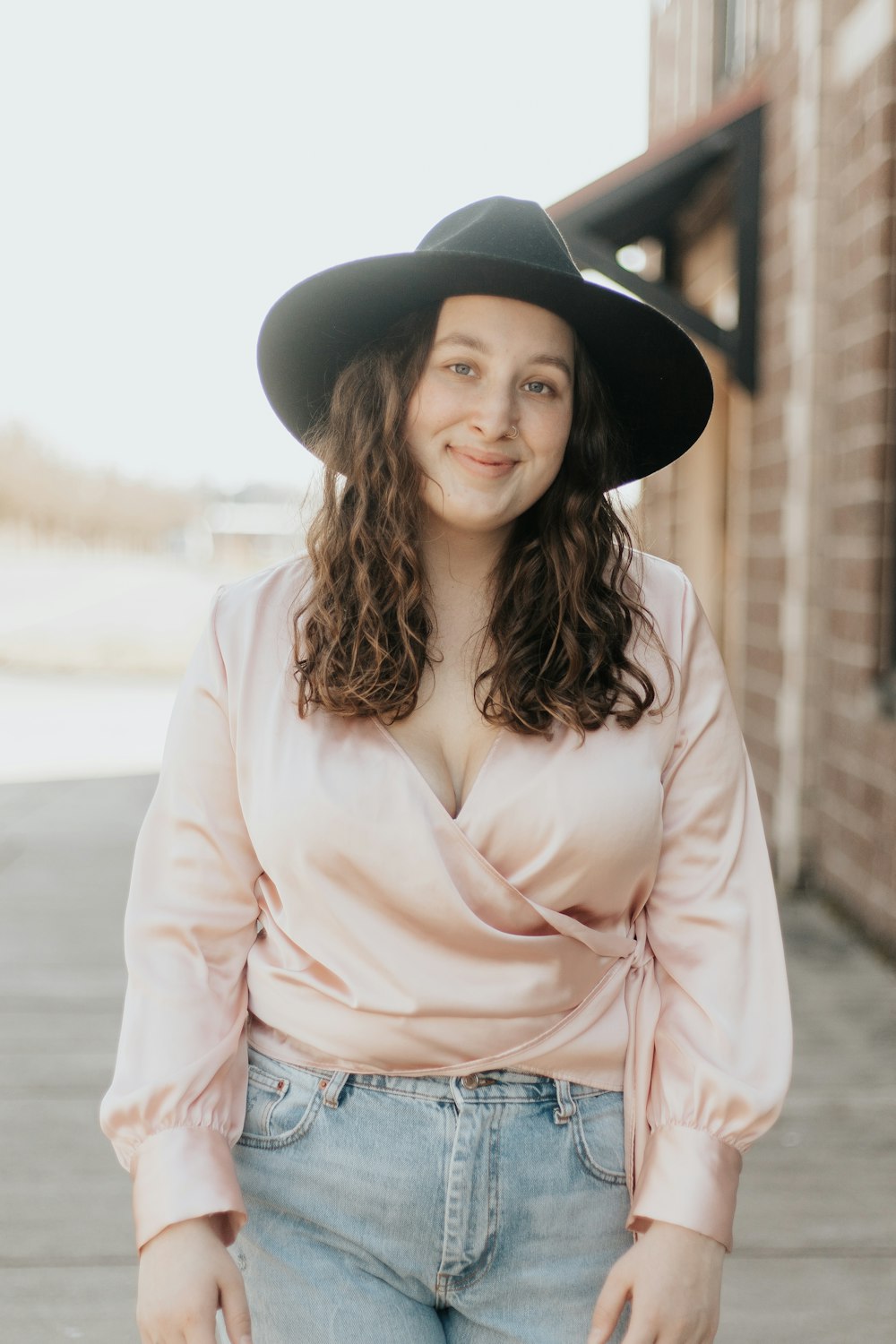 woman in black hat and white long sleeve shirt