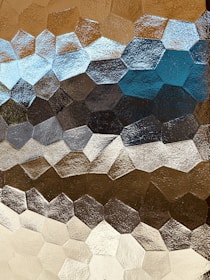 Abstract design featuring hexagons and warm tones.