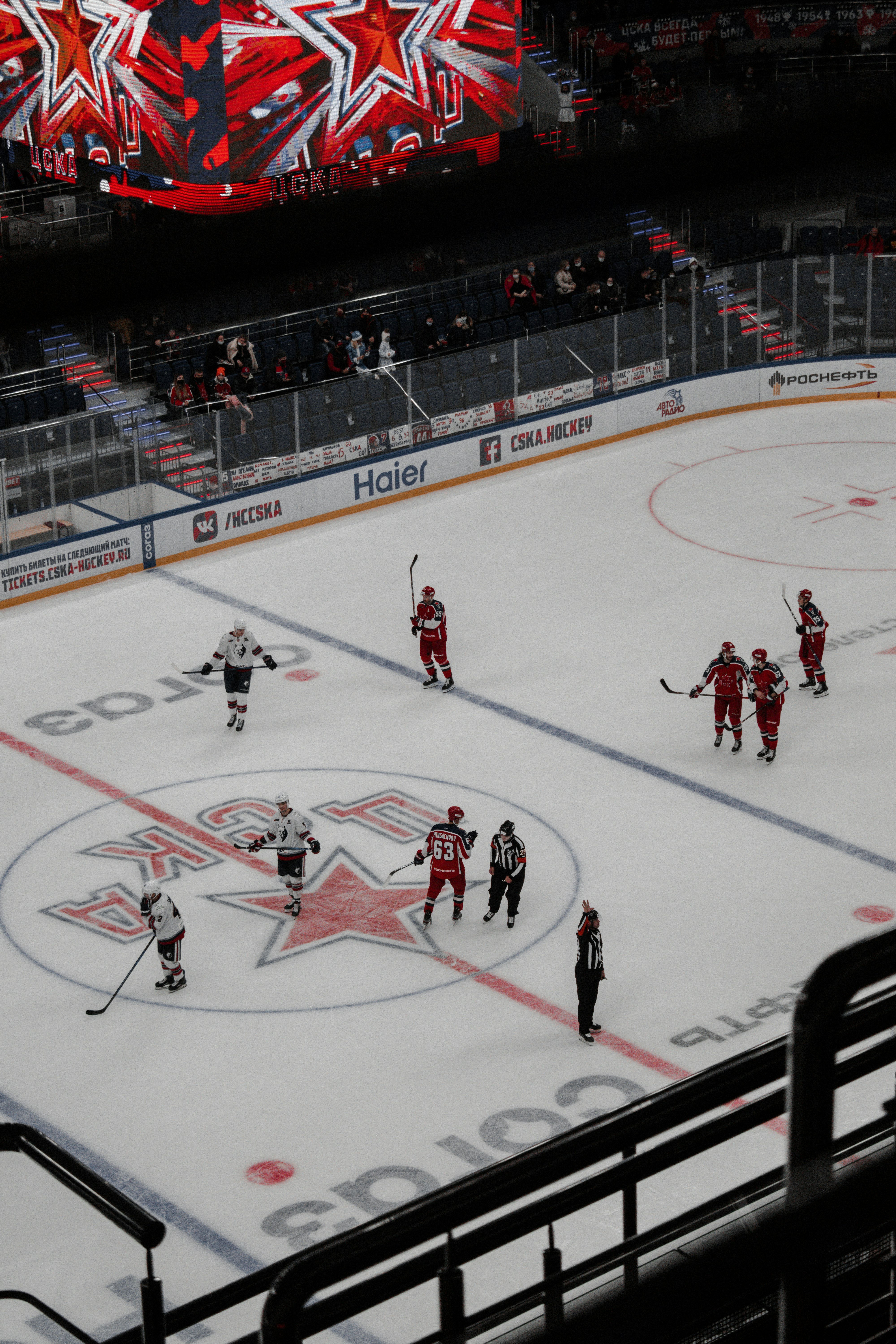 people playing ice hockey on ice stadium