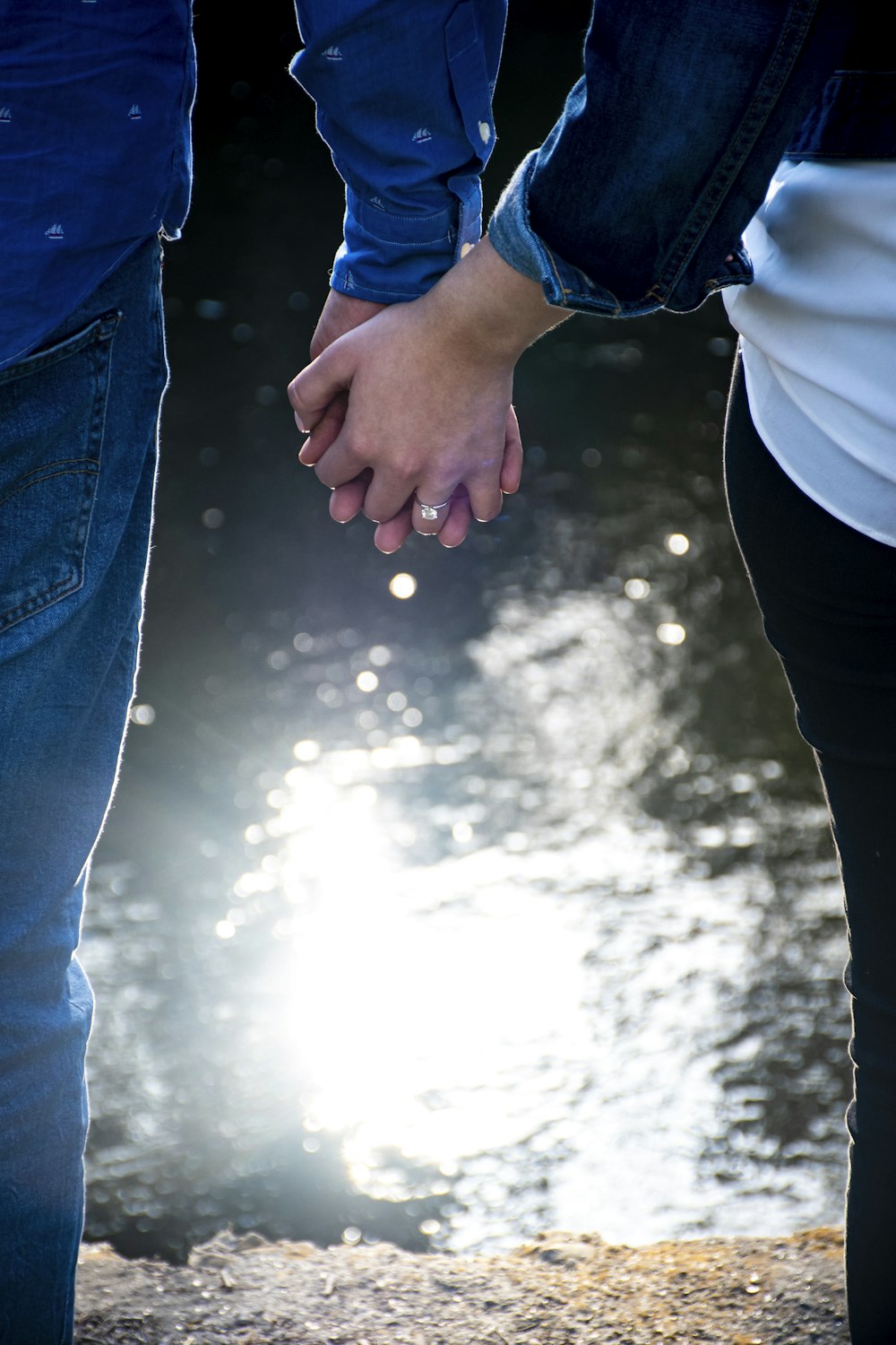 person in blue denim jeans and white shirt