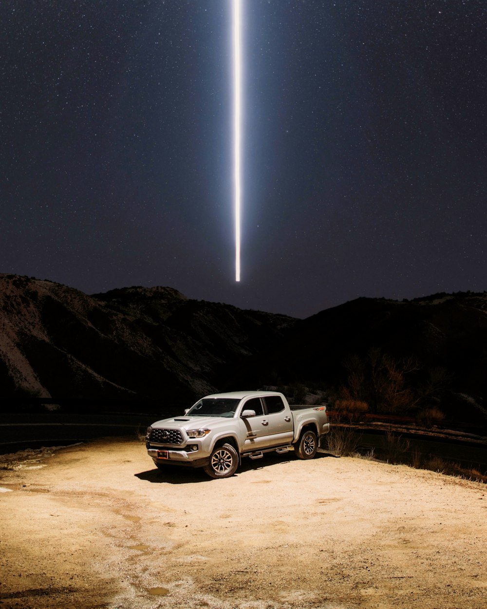 white suv on road during night time