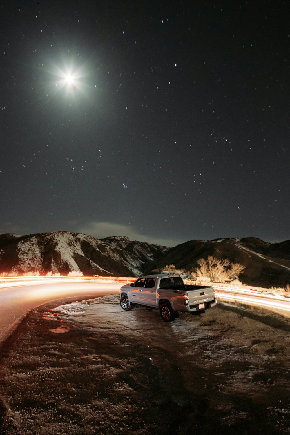 white suv on road during night time