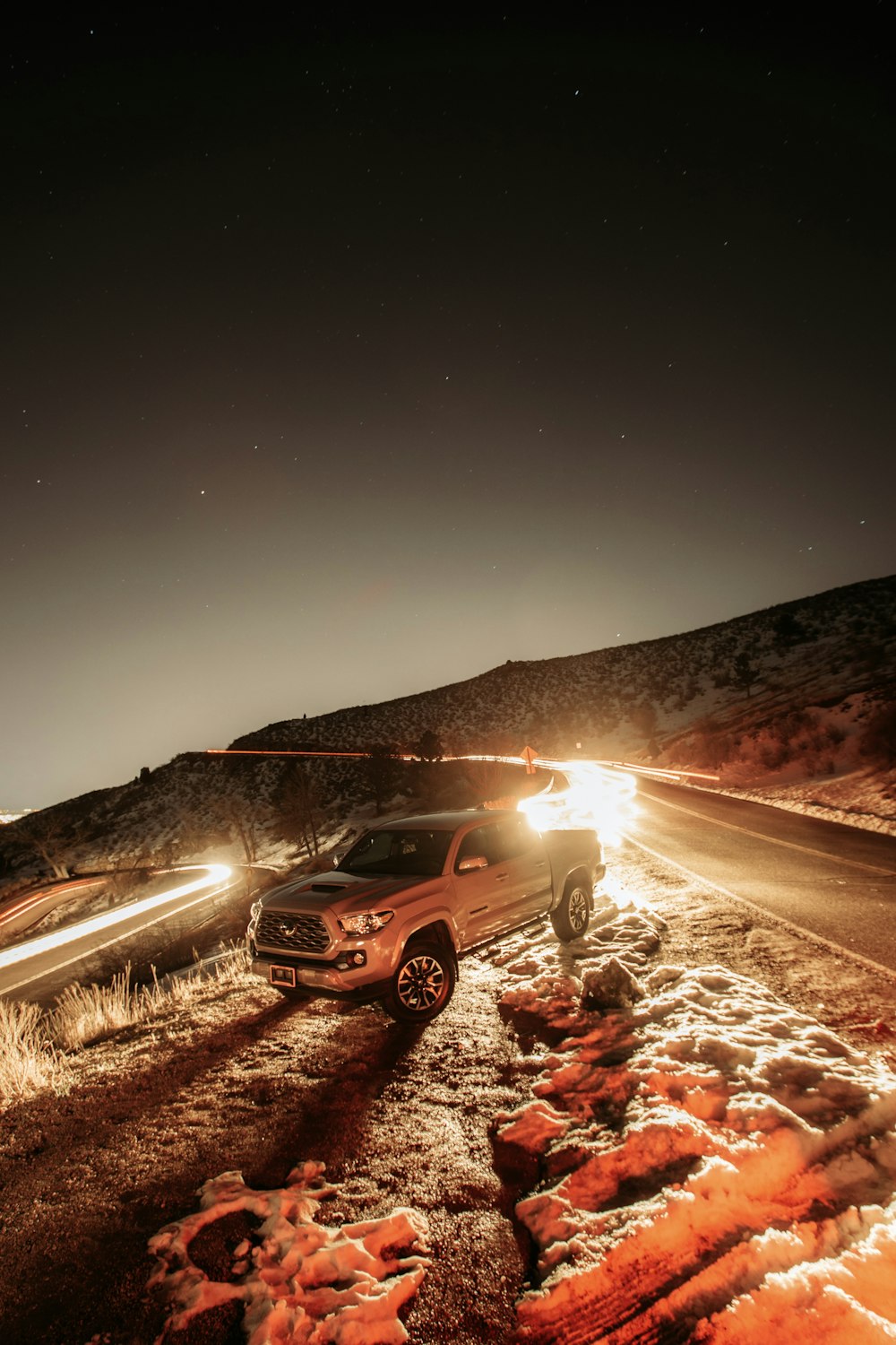 black suv on road during night time