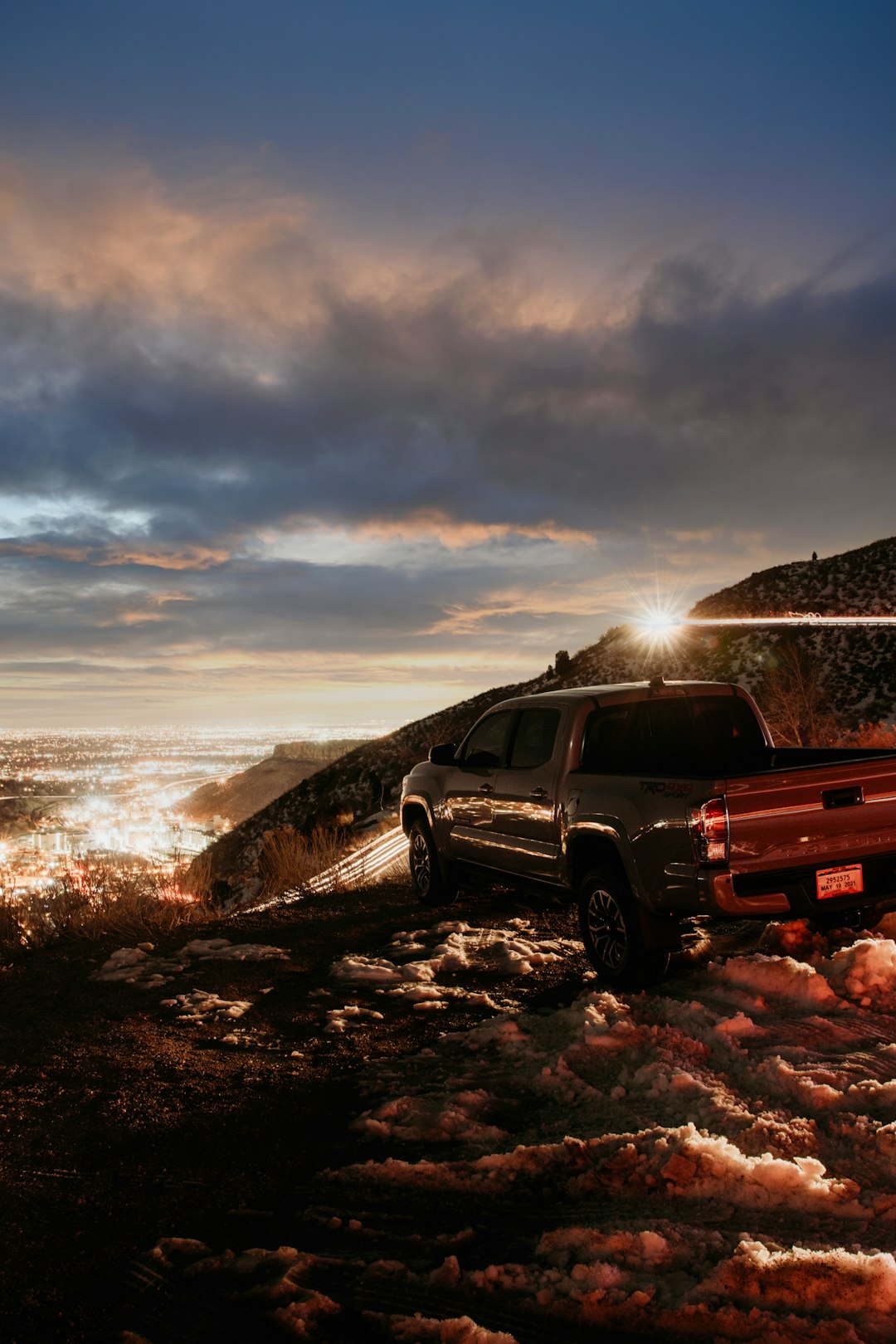 black crew cab pickup truck on gray dirt road during daytime